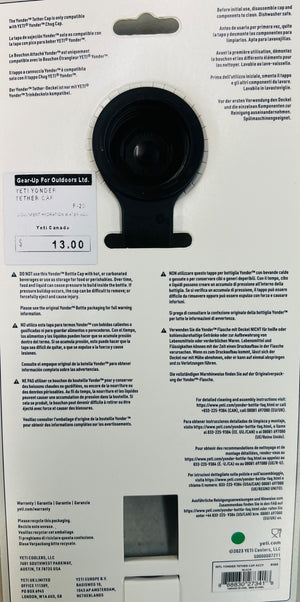 Black lens cap on a product packaging with text and branding