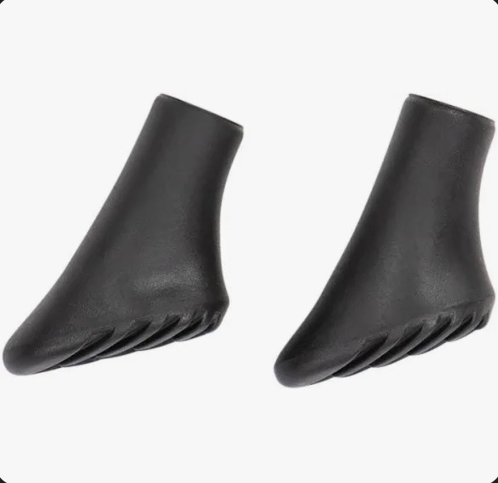 Pair of black five-toe shoes on a white background