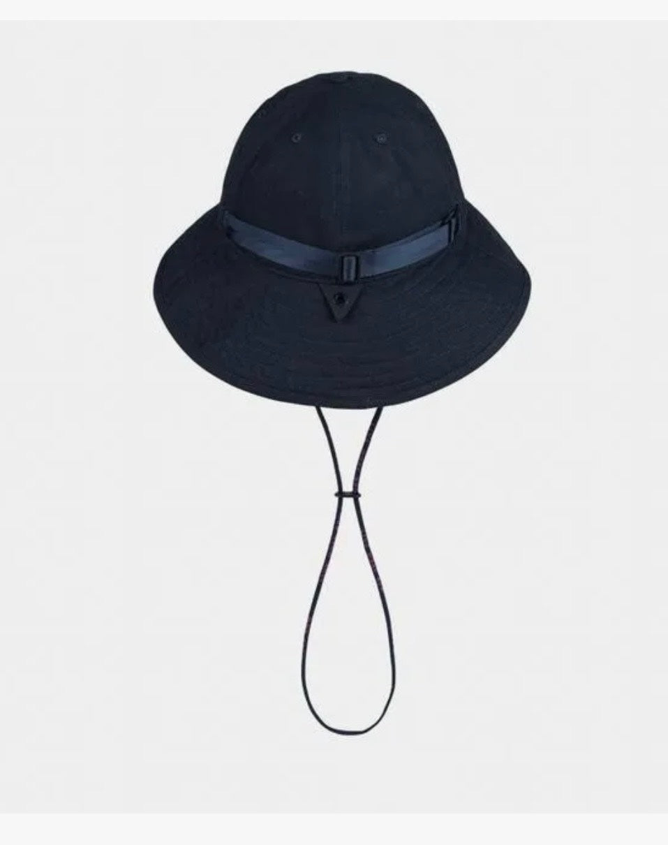 Black bucket hat with a strap on a light gray background