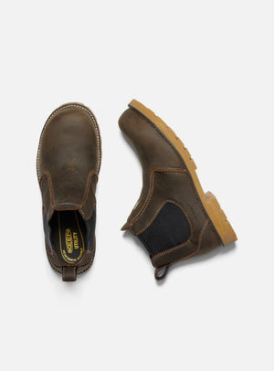 Pair of brown leather boots with a visible brand logo on a white background