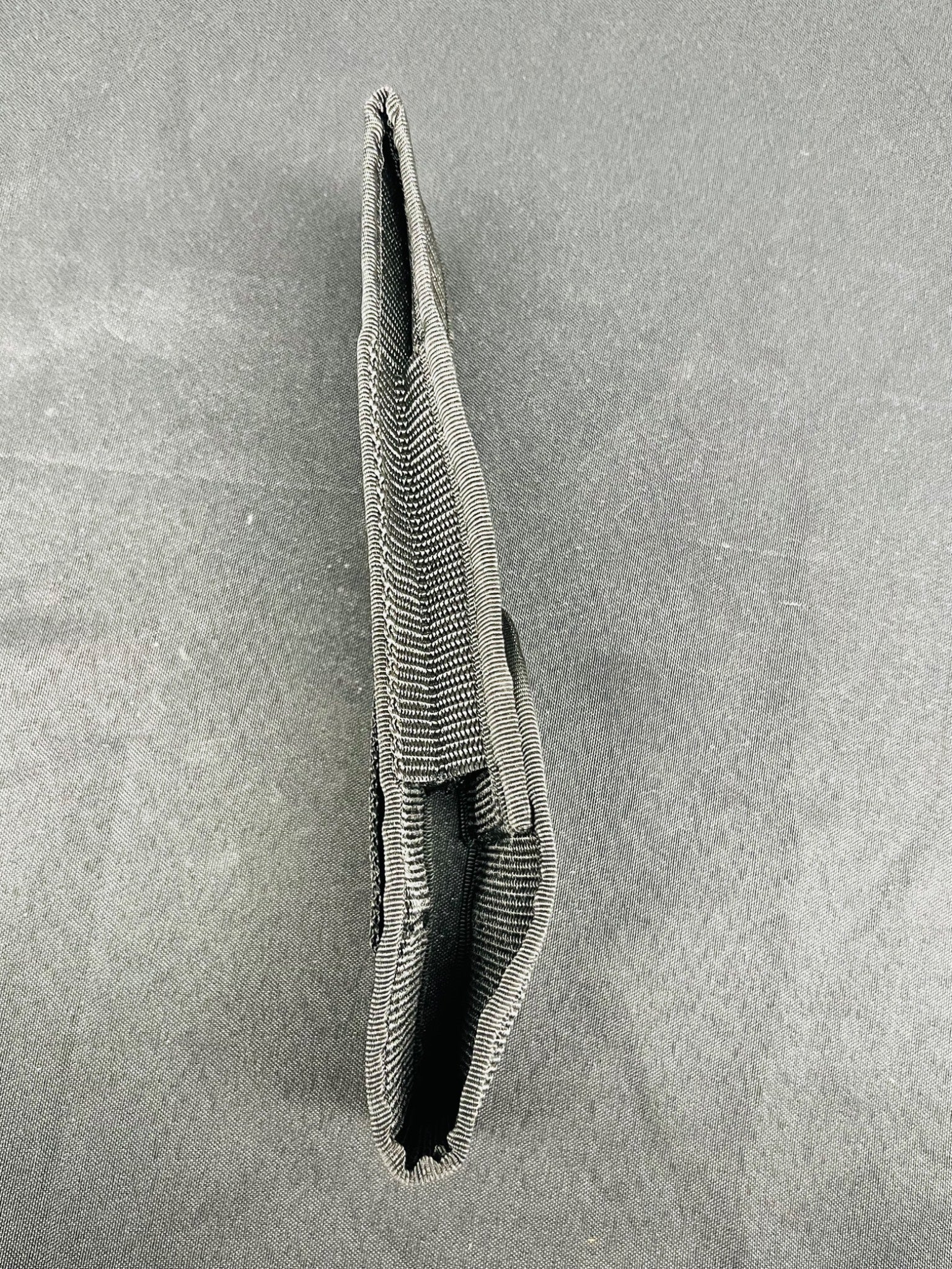 Textured pouch on a gray background