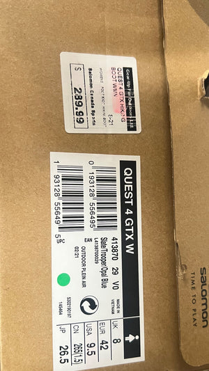 Cardboard box with Quest 4 GTX IV label and barcode on a brown background