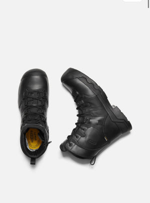 Pair of black tactical boots on a white background