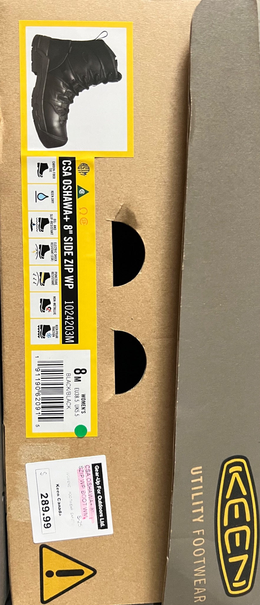 Box of Keen utility footwear with a label on a brown background