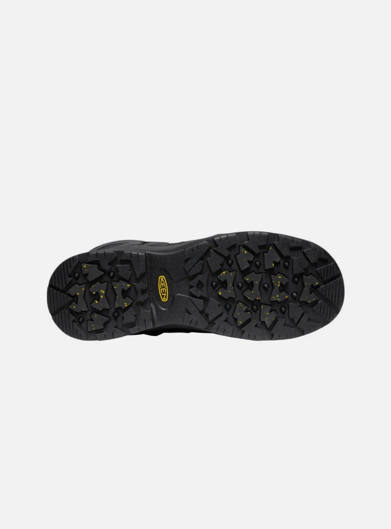 Black shoe sole with tread pattern on a white background