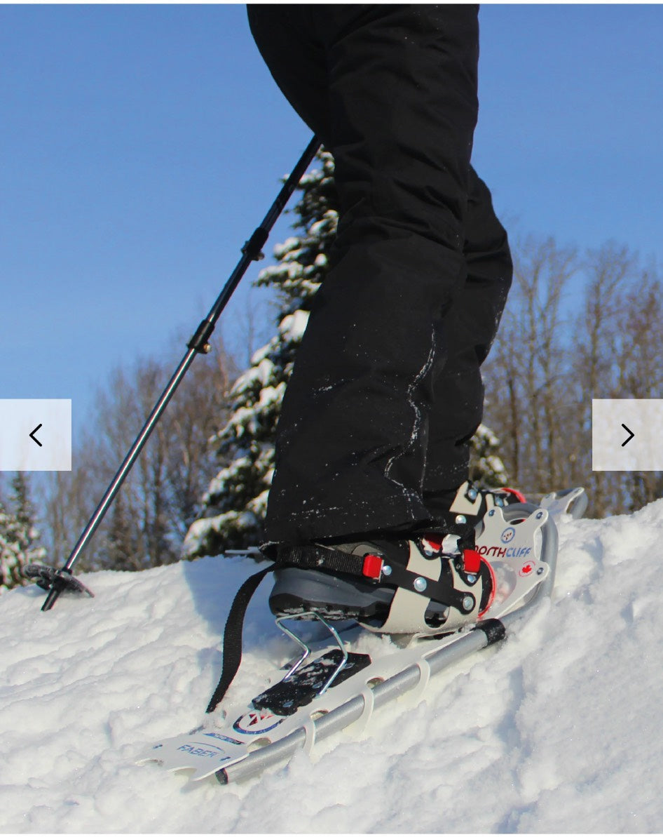 Person skiing with snowshoes on a snowy landscape