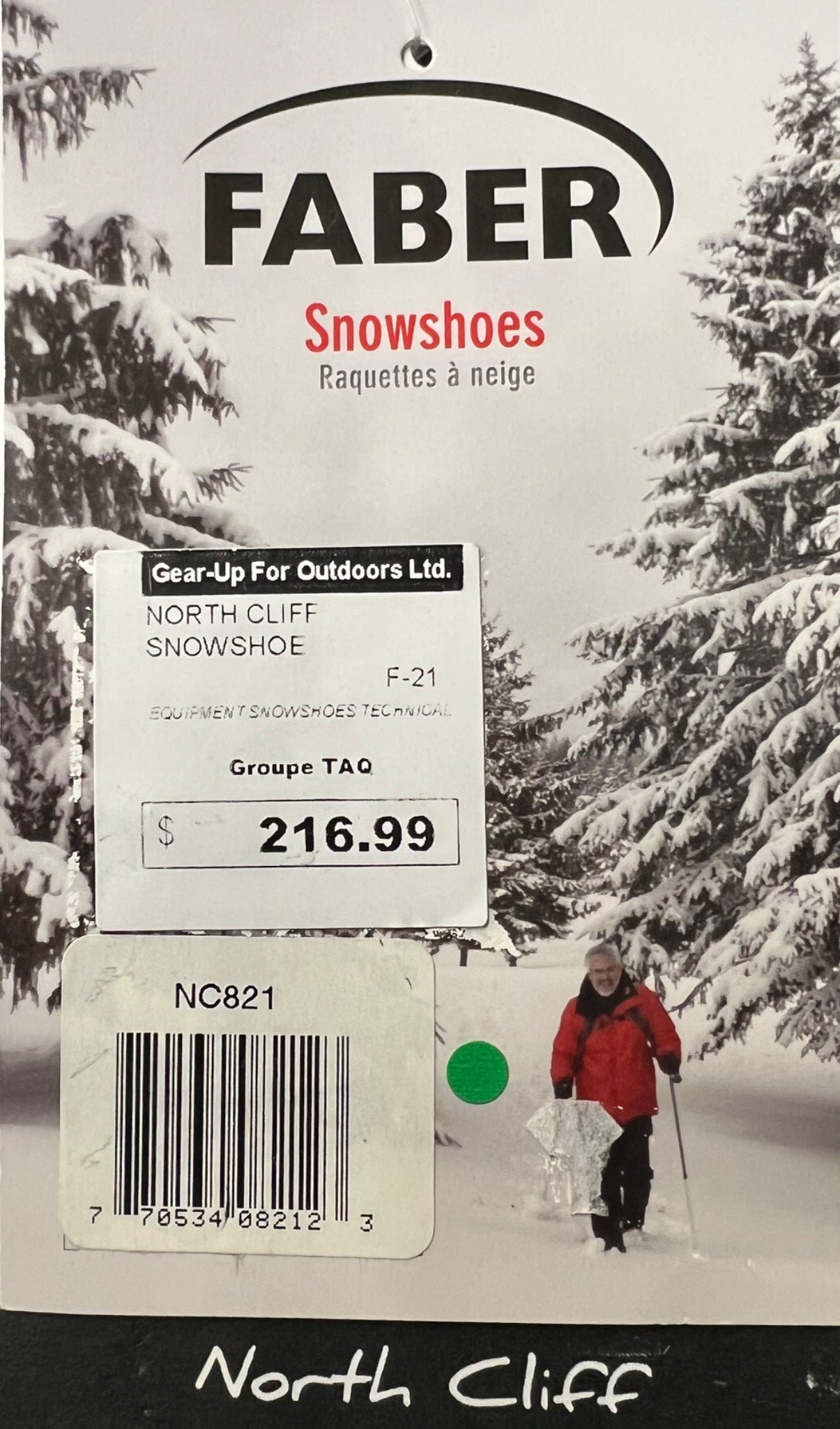 Faber snowshoes packaging with a snowy landscape and person in the background