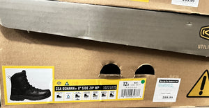 Box of boots with labels and a warning sign on a cardboard surface