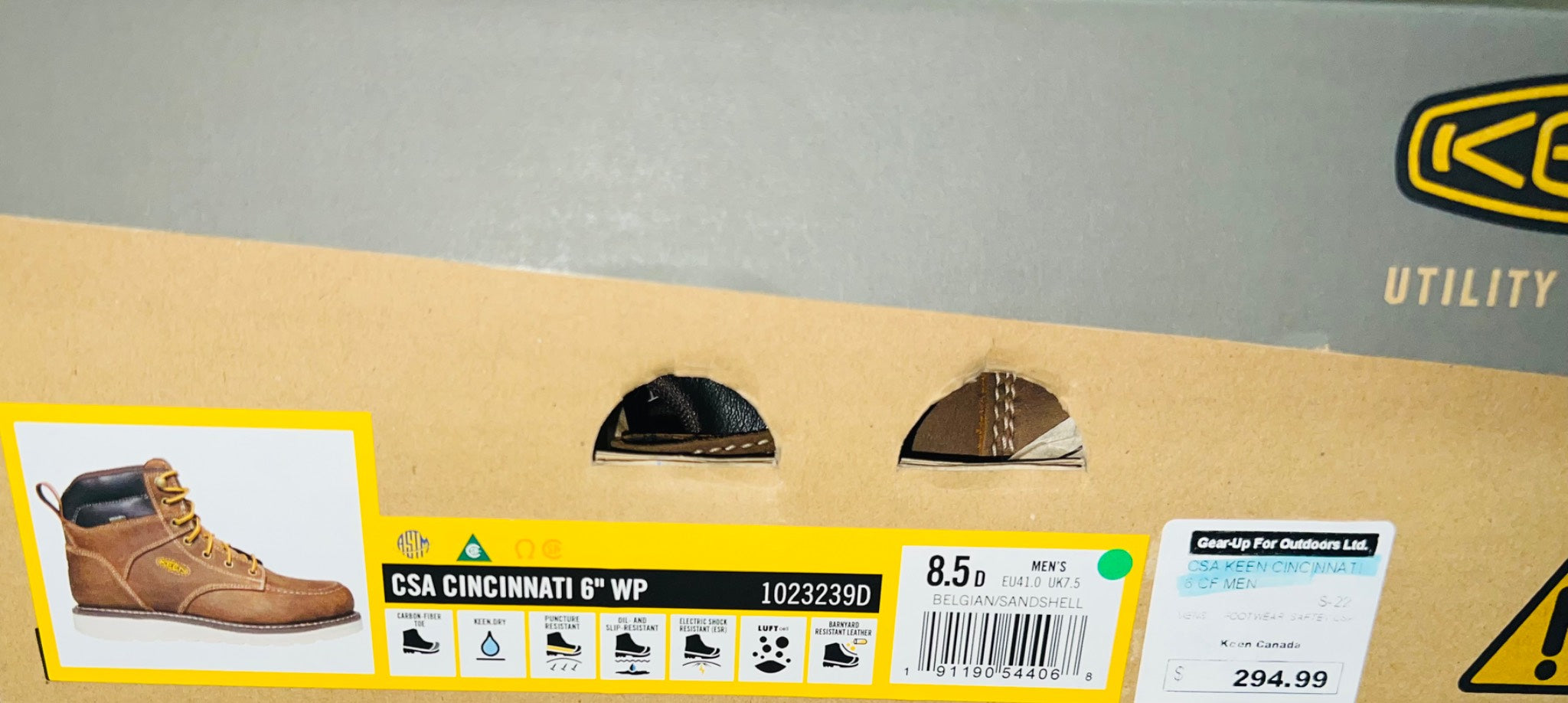 Box of Klima Utility boots with a label on a gray background