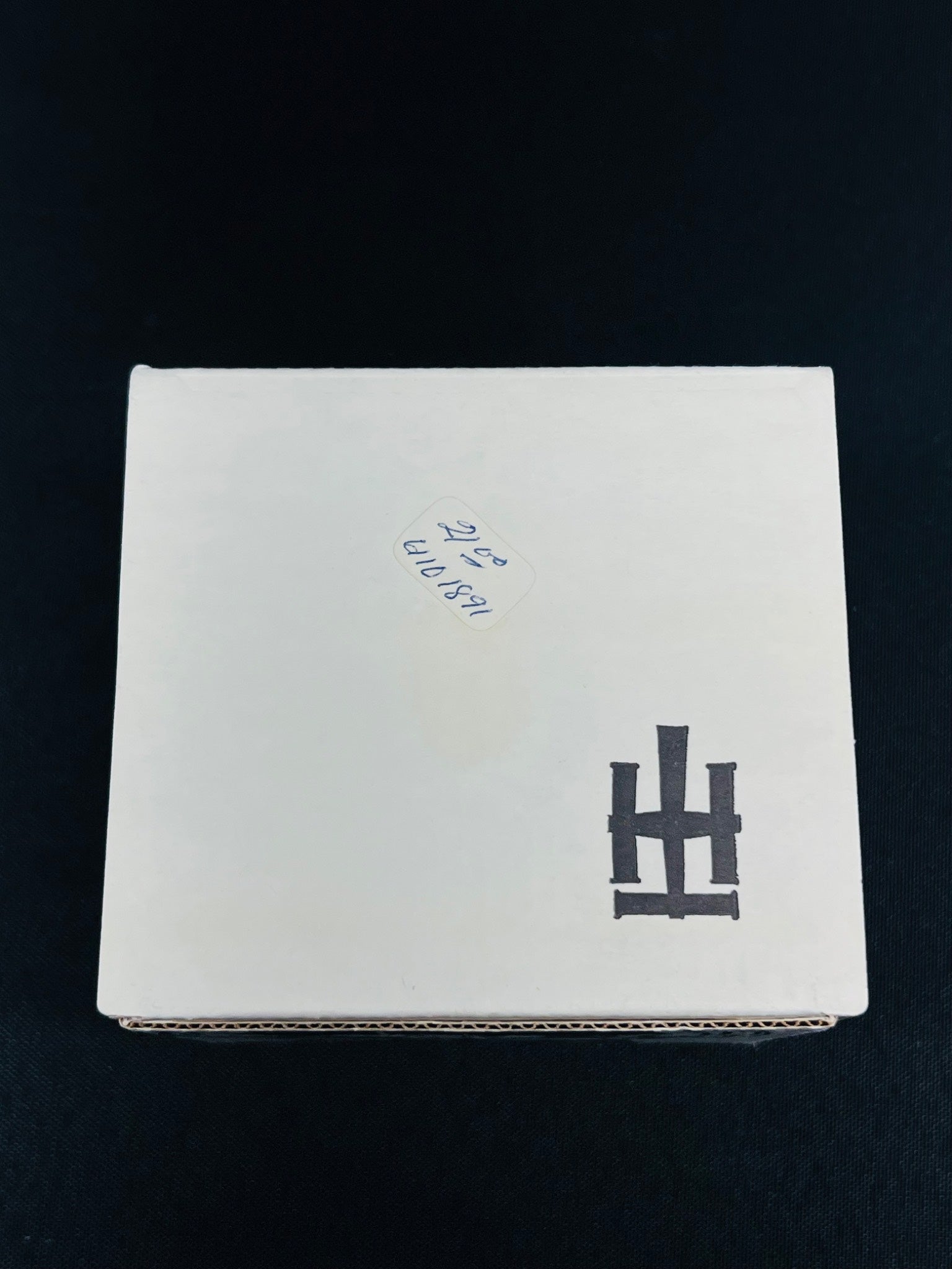 White box with black and blue text on a black background