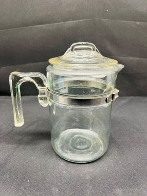 Clear glass jar with a lid on a gray background