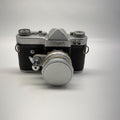 Vintage camera with 'Omag' branding on a white background