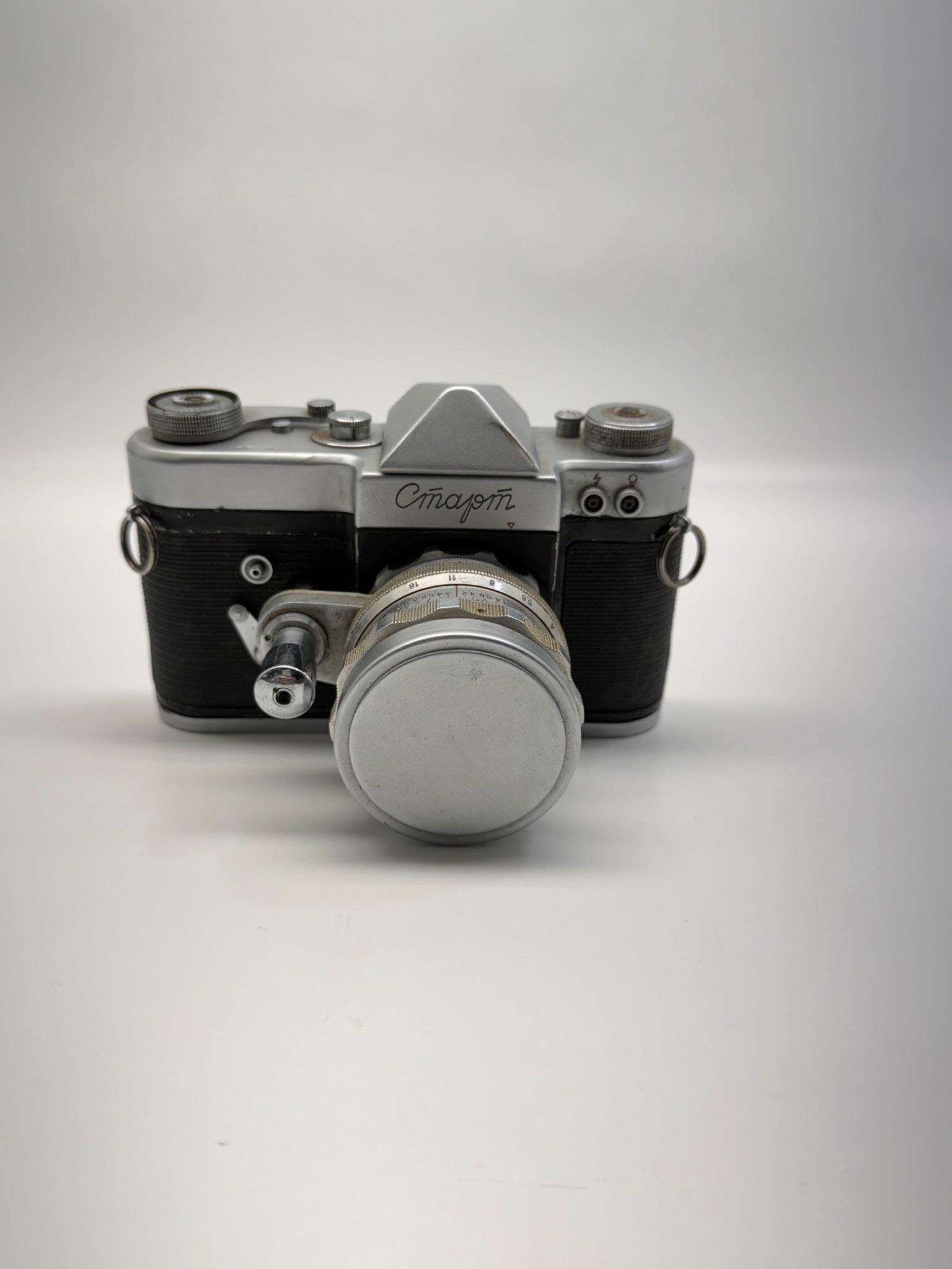 Vintage camera with 'Omag' branding on a white background