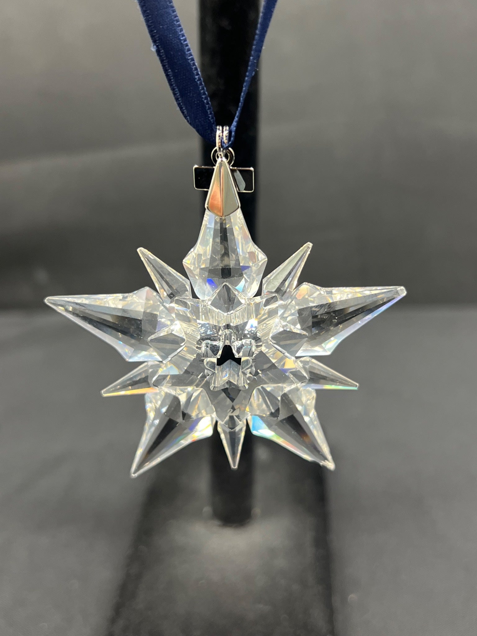 Crystal star ornament on a black background
