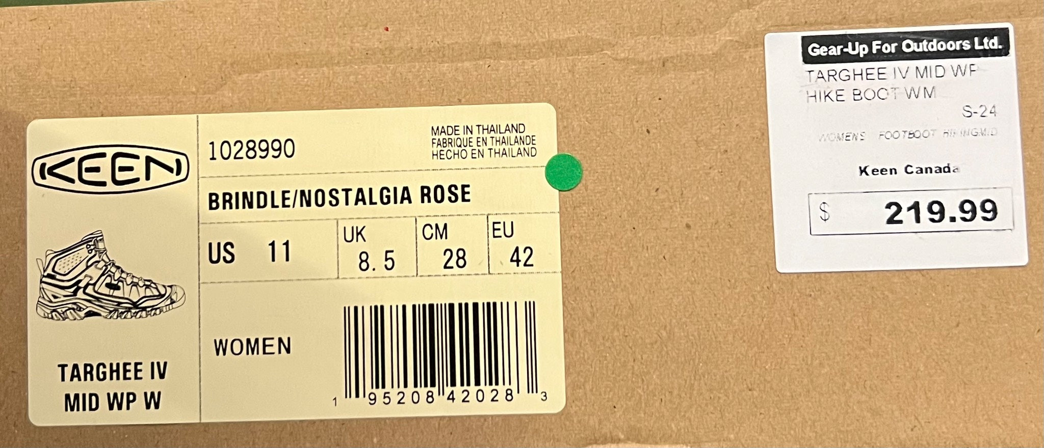 Keen shoe box with product label and price tag on a cardboard background