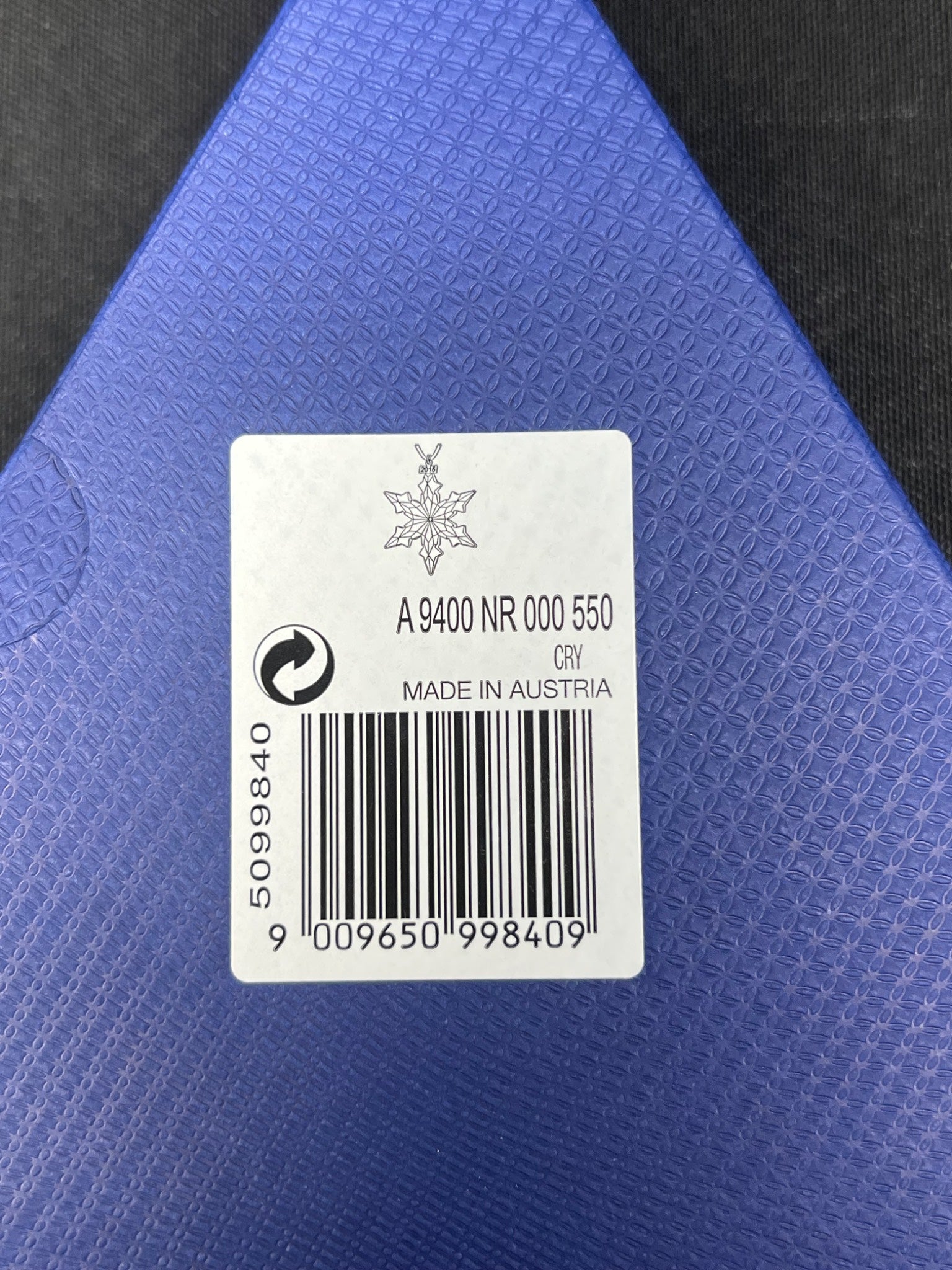 Label with product details on a blue textured surface
