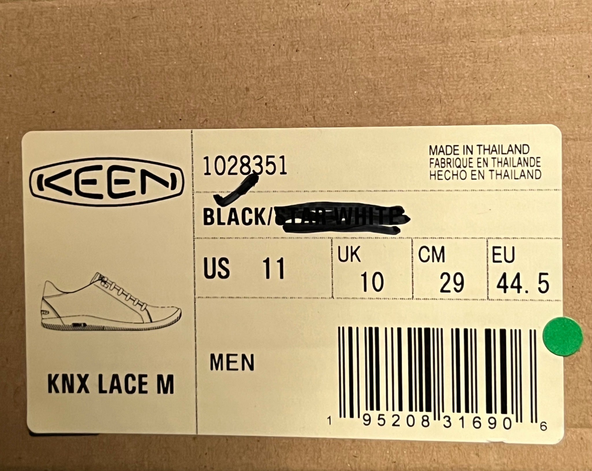 Keen shoe label with product details on a cardboard background