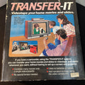 Advertisement for Transfer-It videotape system showing a family using a television.