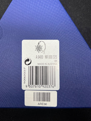 Product label with barcode and text on a blue textured background