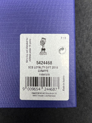 Label on a purple object with text and a barcode