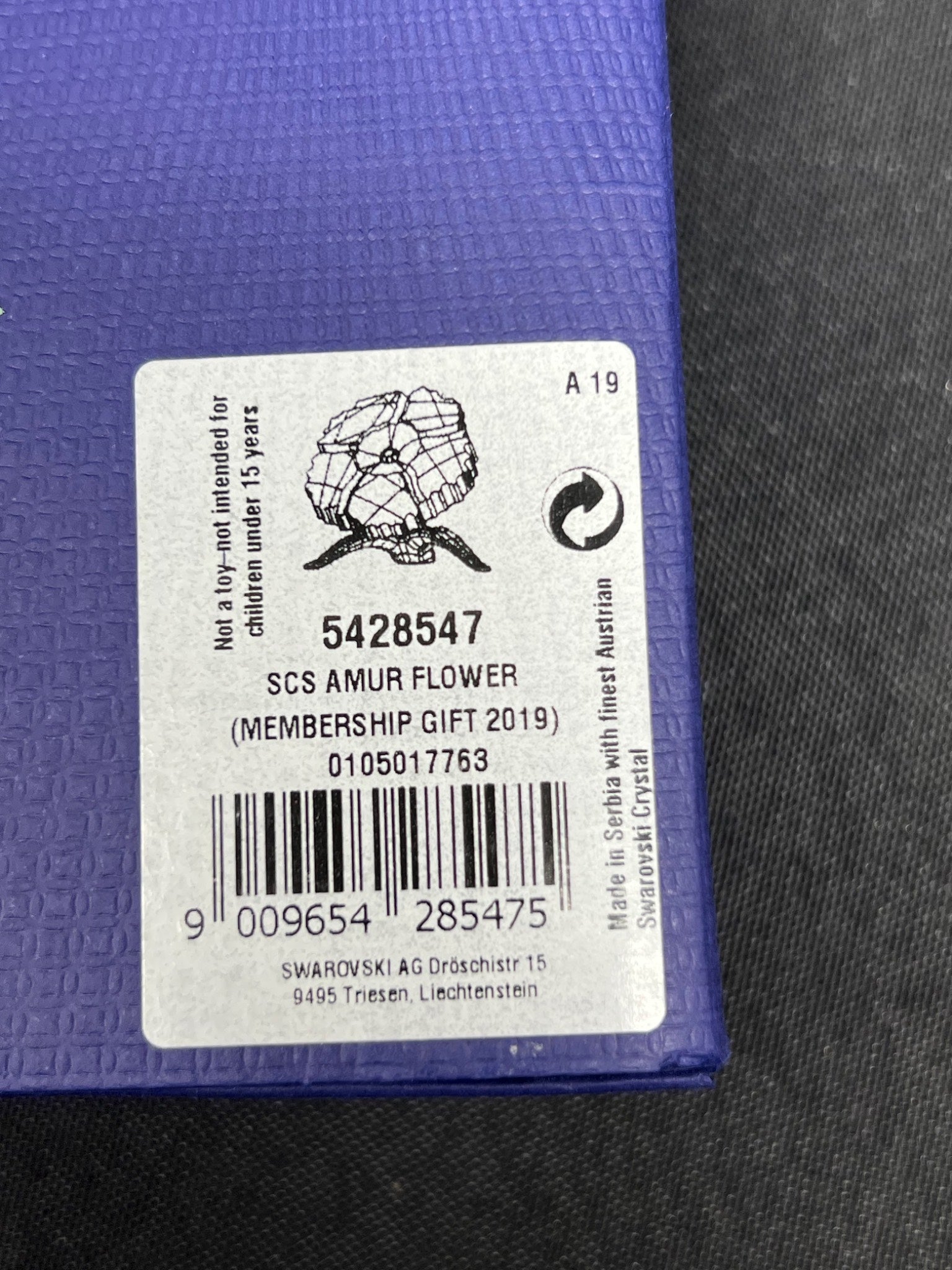 Label on a purple product with text and a barcode
