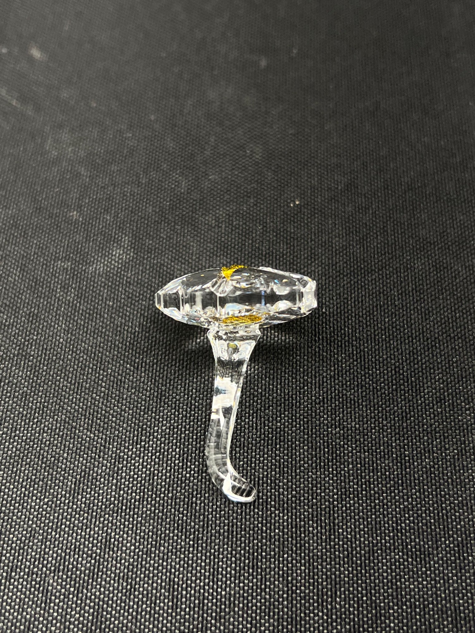 Clear glass ring on a black background