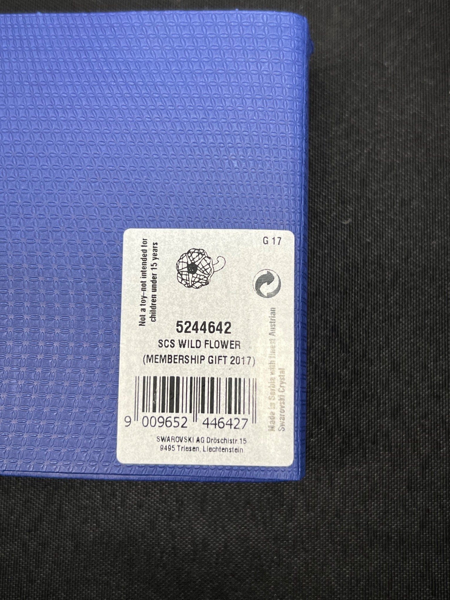 Blue fabric with a label on a black background