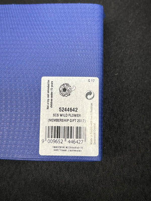 Blue fabric with a label on a black background