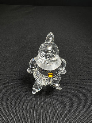 Crystal gnome figurine on a black background