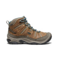 Brown hiking boot with gray sole on a white background