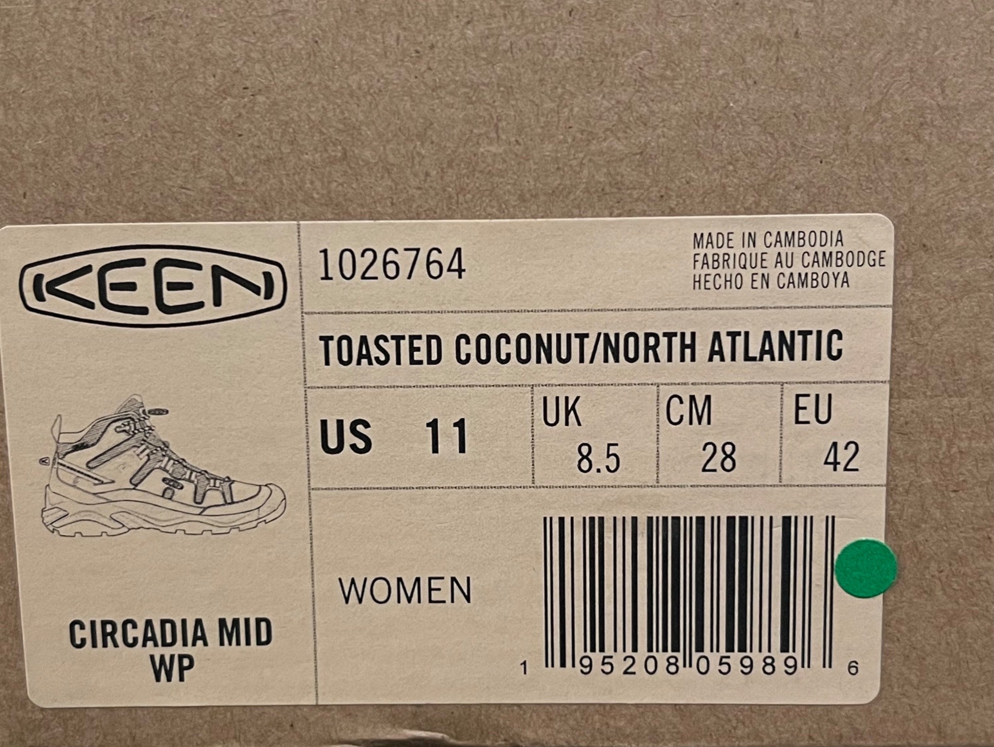 Keen brand label on a cardboard background with product details.
