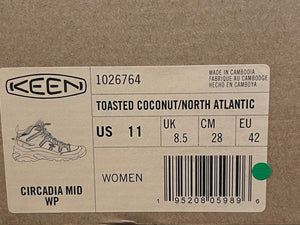 Keen brand label on a cardboard background with product details.