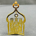 Gold ornament with three figures and a star on a gray background