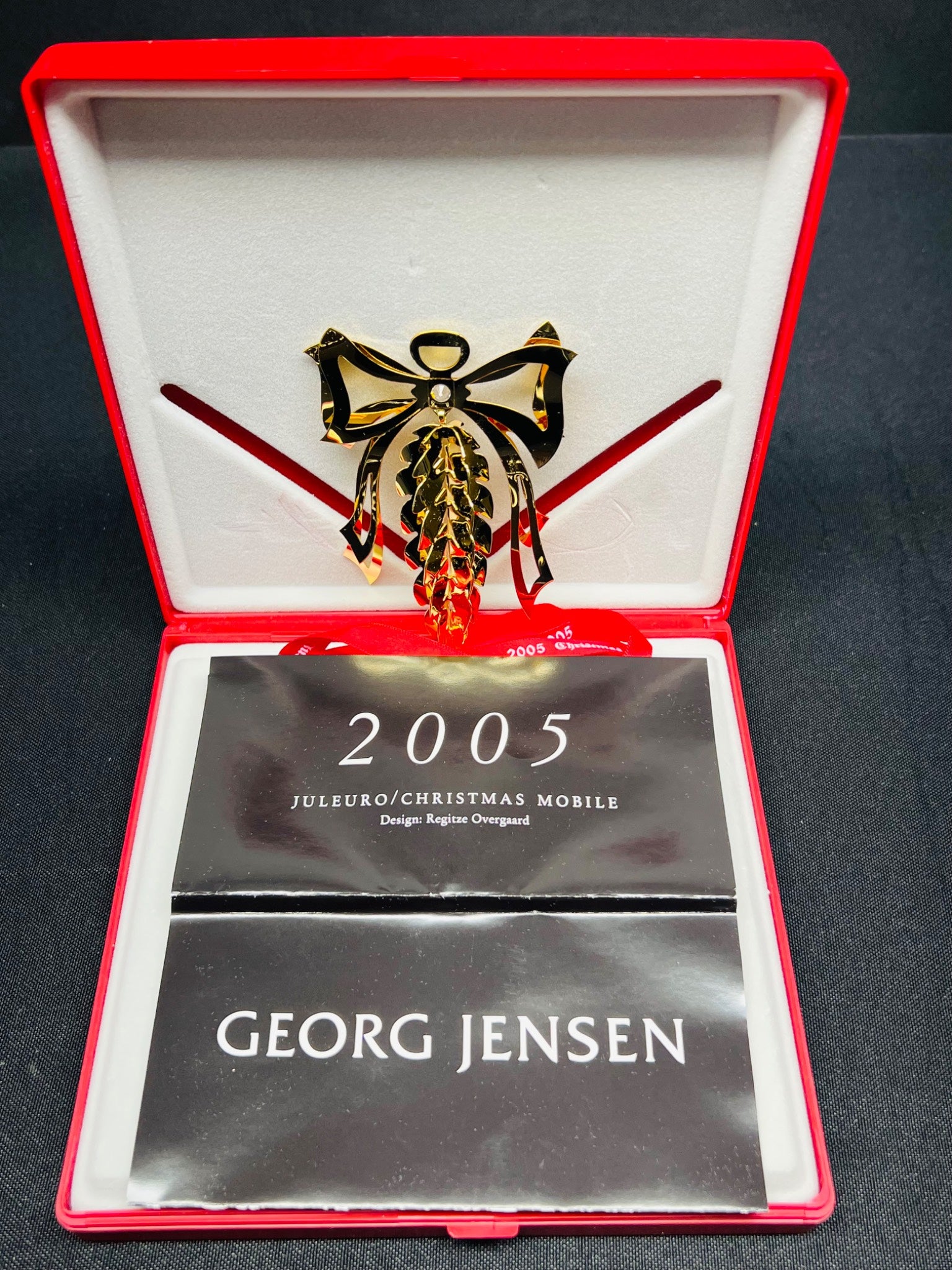 Georg Jensen Christmas Mobile brooch in a red box with '2005' and 'Juleukko' text.