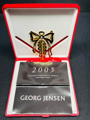 Georg Jensen Christmas Mobile brooch in a red box with '2005' and 'Juleukko' text.