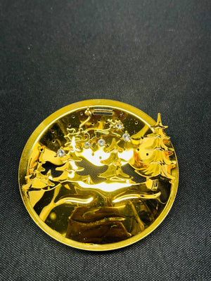 Gold coin with intricate design on a black background