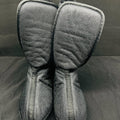 Pair of gray mesh oven mitts on a dark surface