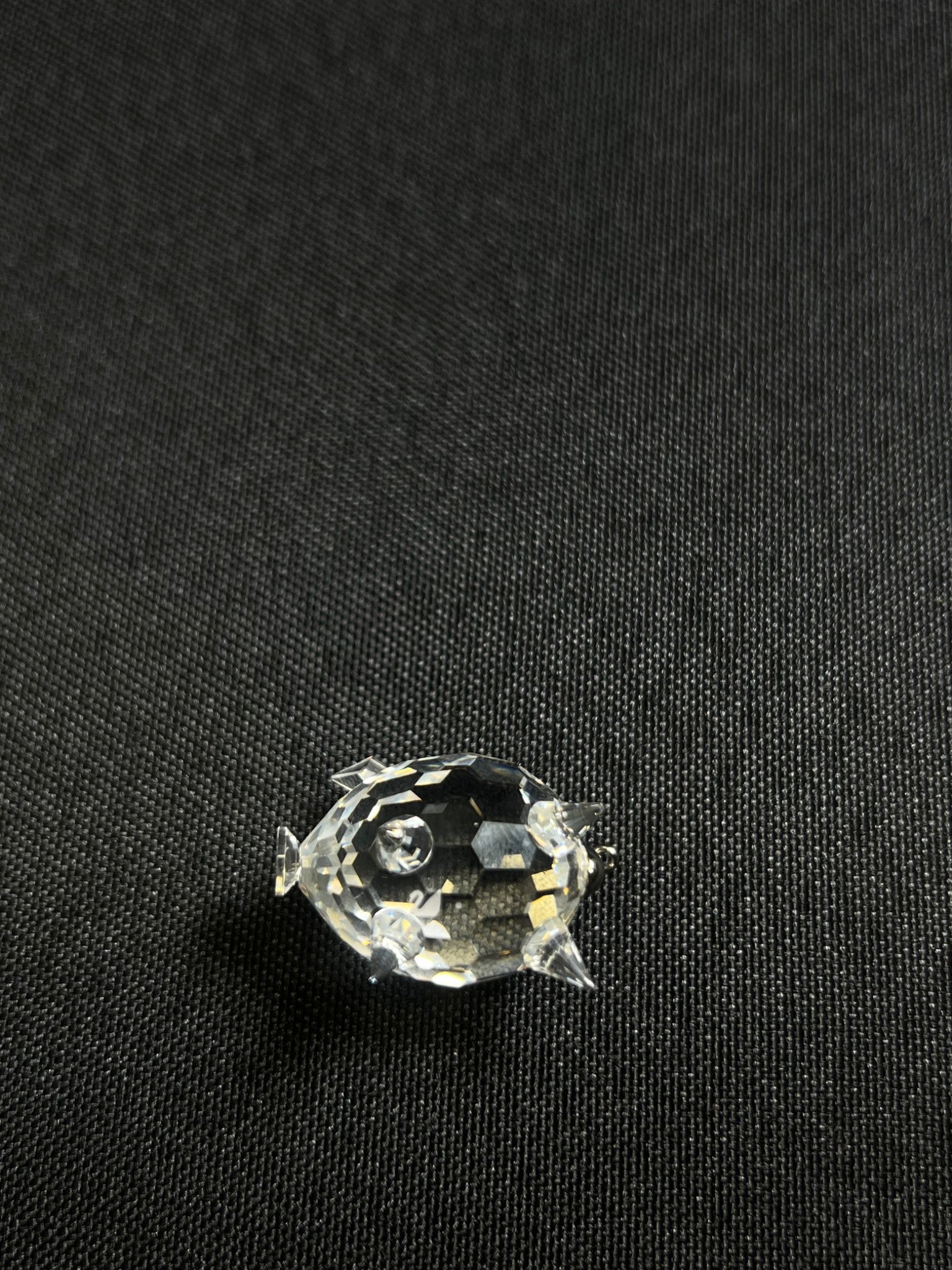 Clear rhinestone on a black fabric background