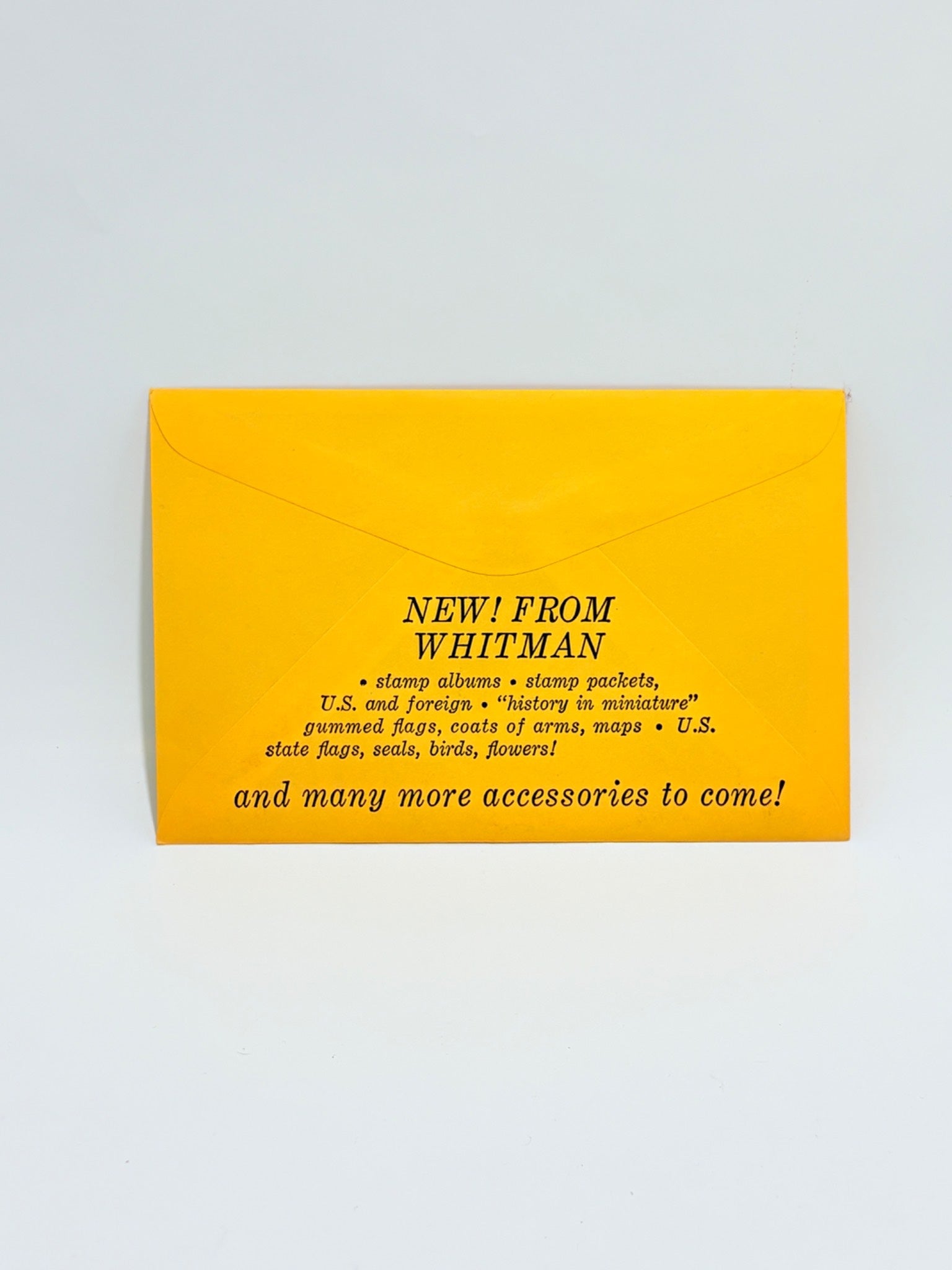 Yellow envelope with black text on a light gray background
