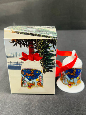 Decorative Christmas bell ornament with packaging on a gray background