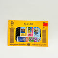 Box of stamps with various designs and 'Qatar' branding on a light gray background