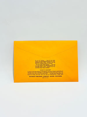 Yellow envelope with black text on a light gray background