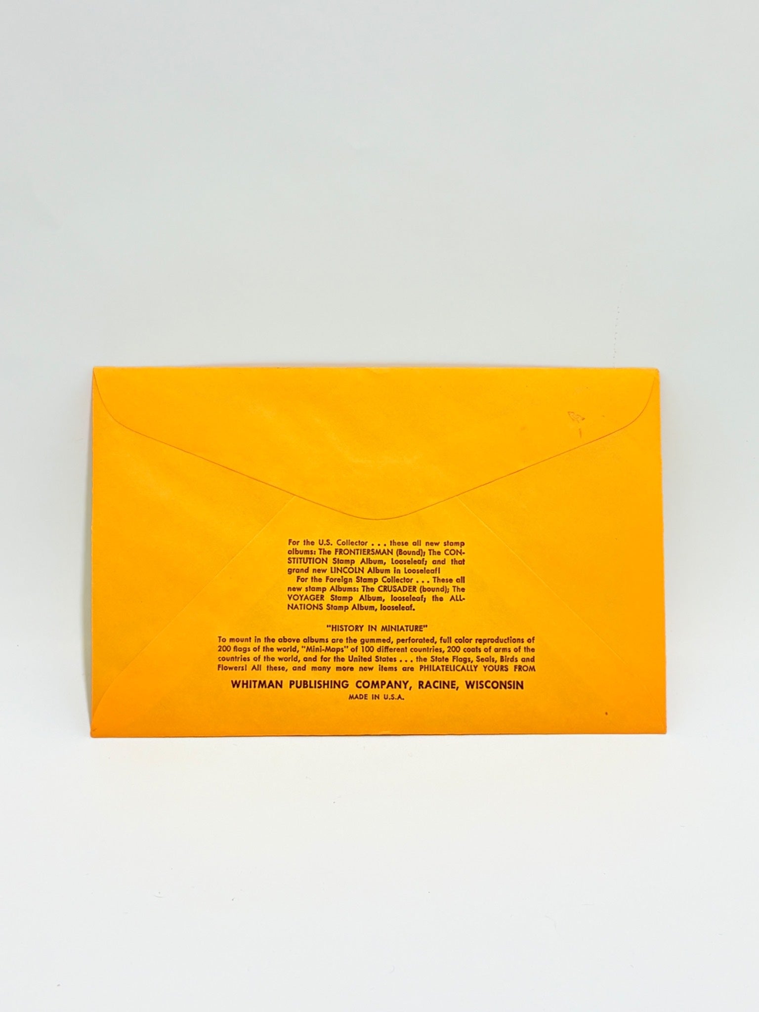 Yellow envelope with text on a gray background