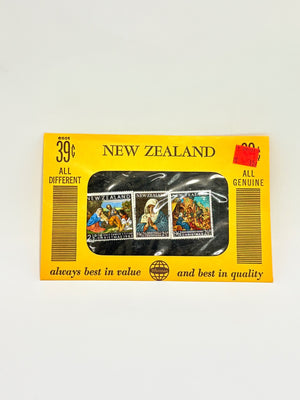 Packaged New Zealand stamps with yellow border and clear window