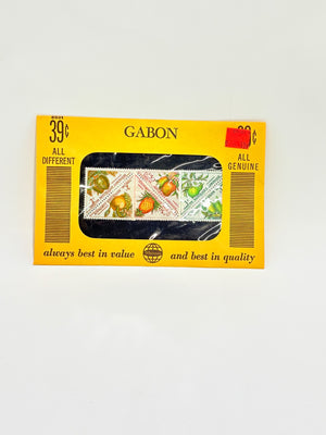 Stamps from Gabon in a collection box with yellow border and 'GABON' branding.