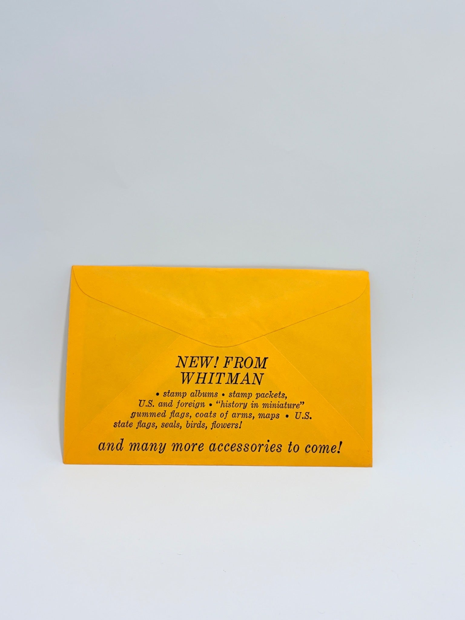 Yellow envelope with black text on a light gray background
