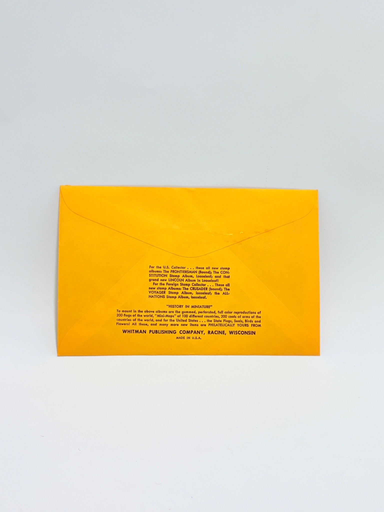 Yellow envelope with text on a light gray background
