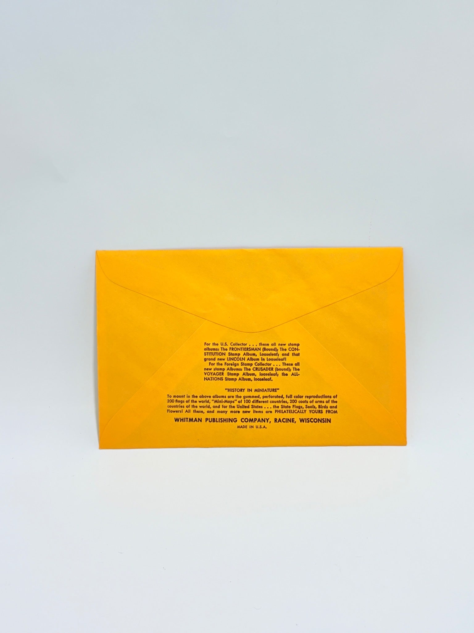 Yellow envelope with text on a light gray background