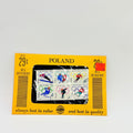 Pack of Polish stamps with a yellow border on a light gray background