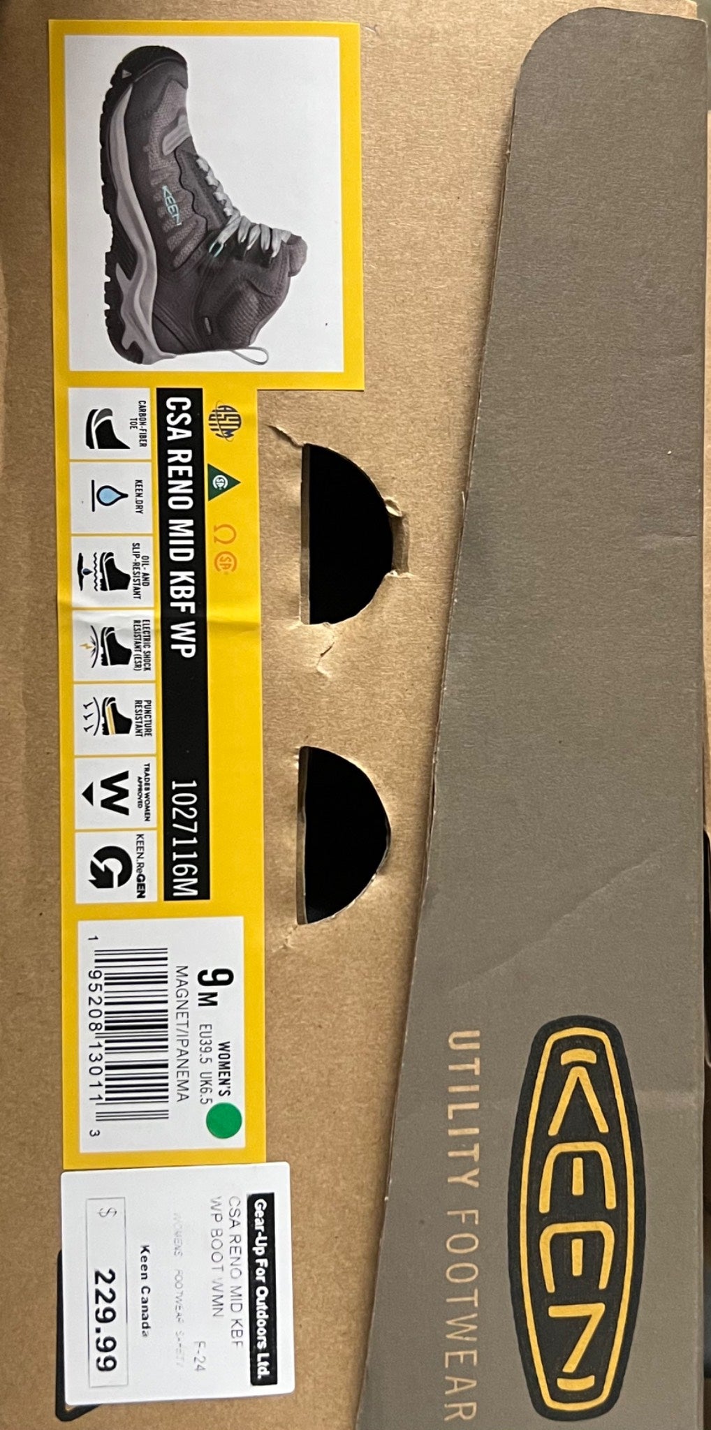 Box of ACDM utility footwear with a label on a cardboard background
